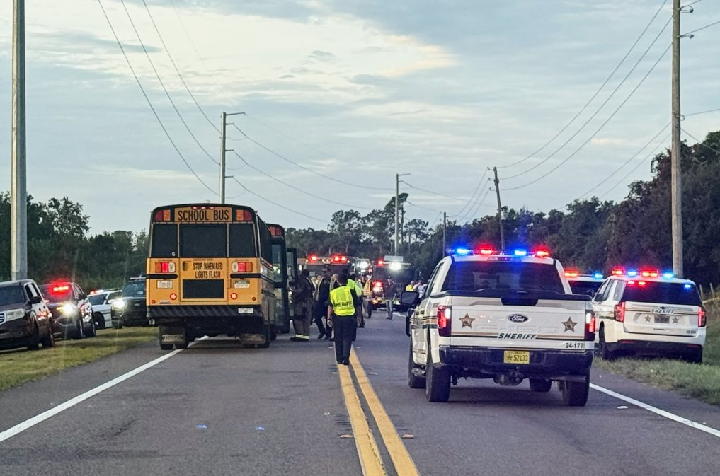 Two people, including a 10th-grade girl, were killed and several others injured Monday when a school bus overturned onto its roof in a multi-vehicle crash in Florida